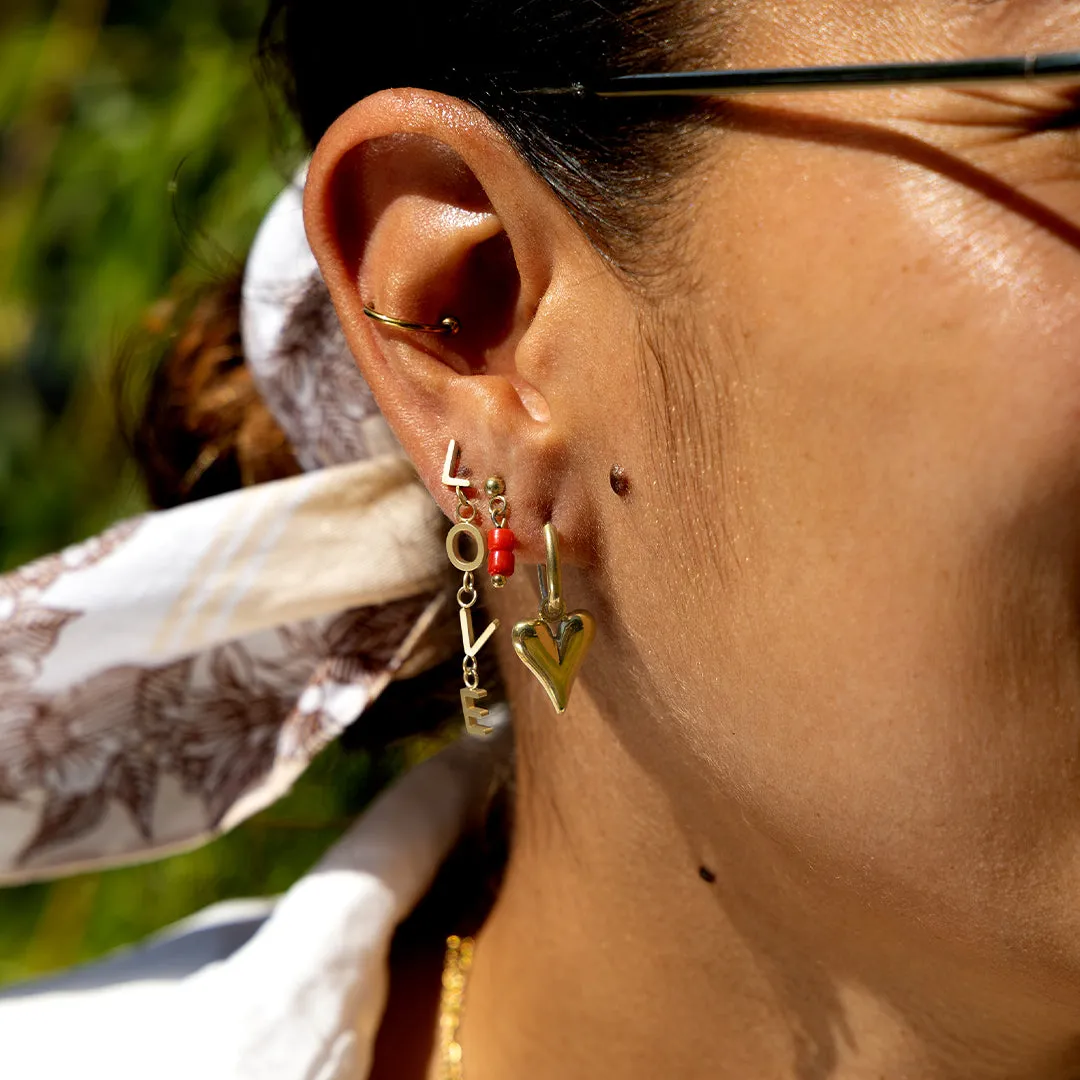 Gold coloured stud earring with L-O-V-E